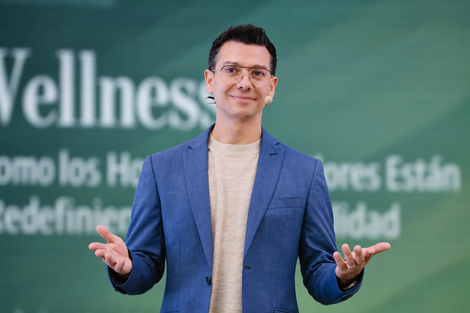 Francisco speaking on stage.