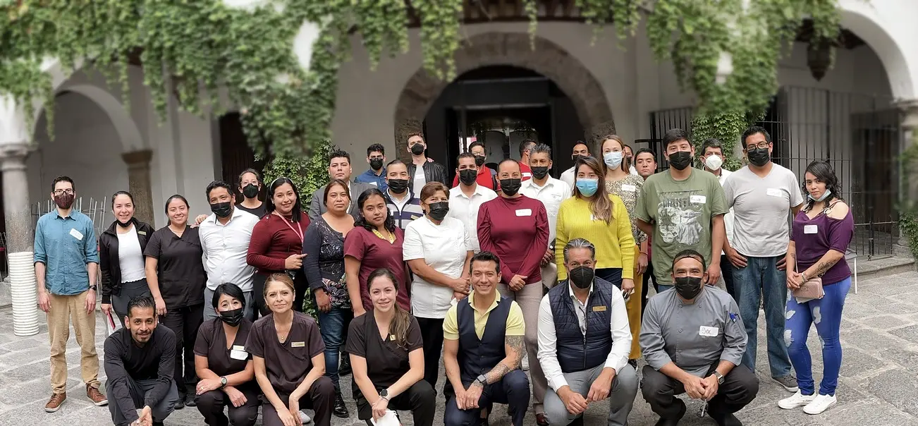 Francisco with the Cartesiano team in the hotel courtyard.