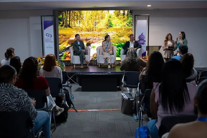 Wide view of the panel stage and the audience.